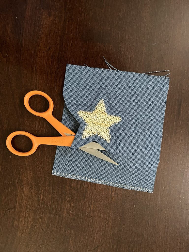 Scissors cutting around star